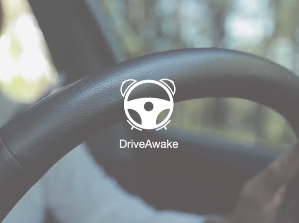 Drive Awake logo over image of steering wheel.