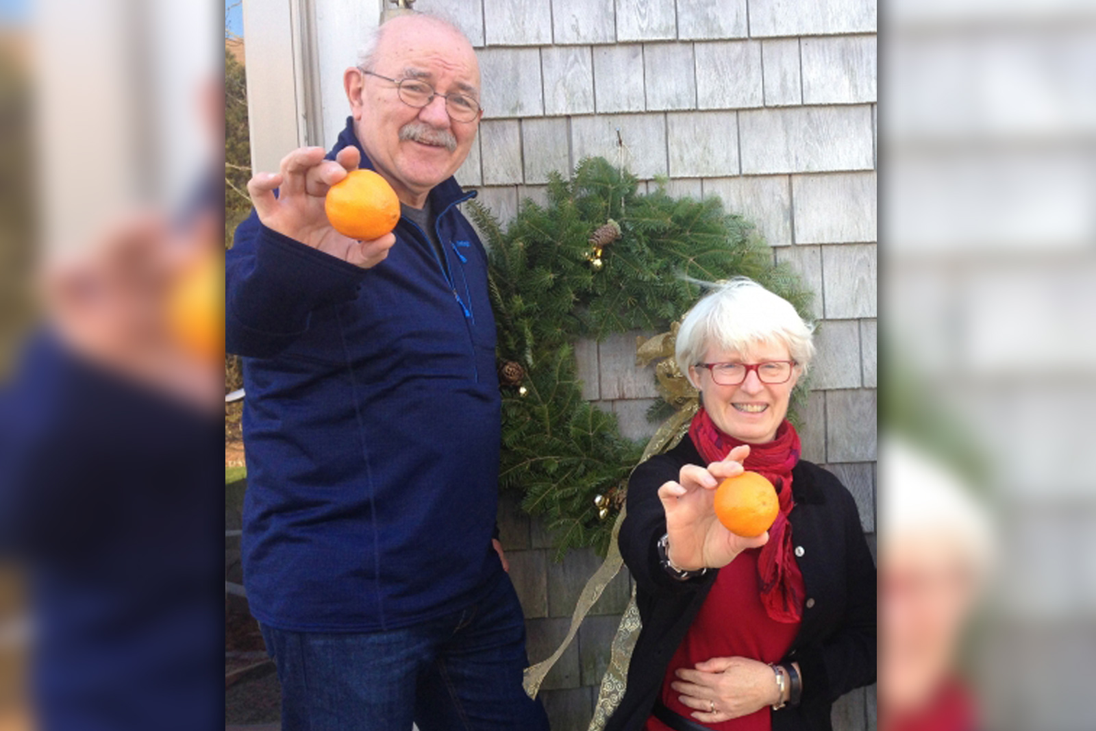 Michael and Julie Rafferty holding oranges