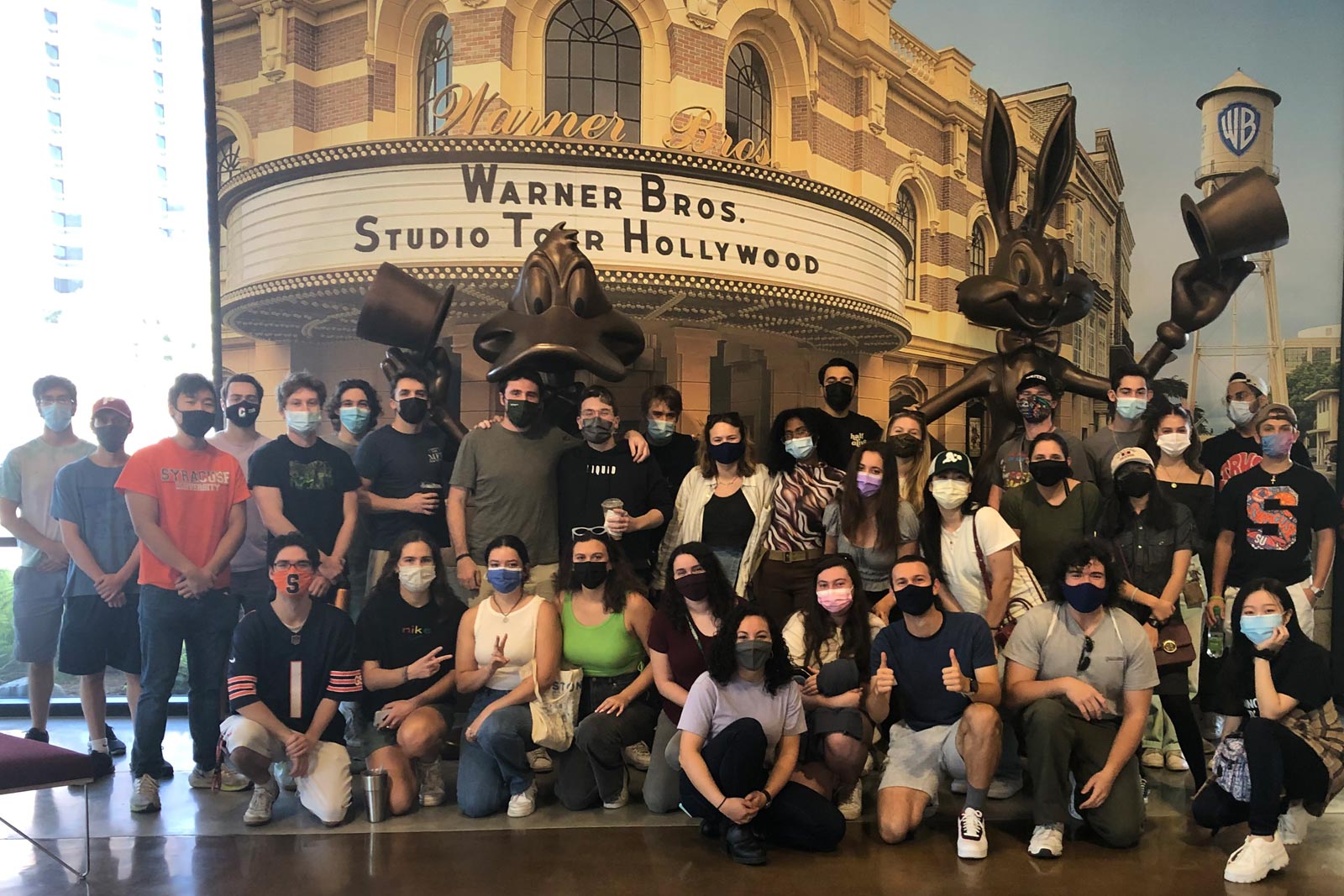 About thirty students gathered for a picture at the Warner Brothers Studio