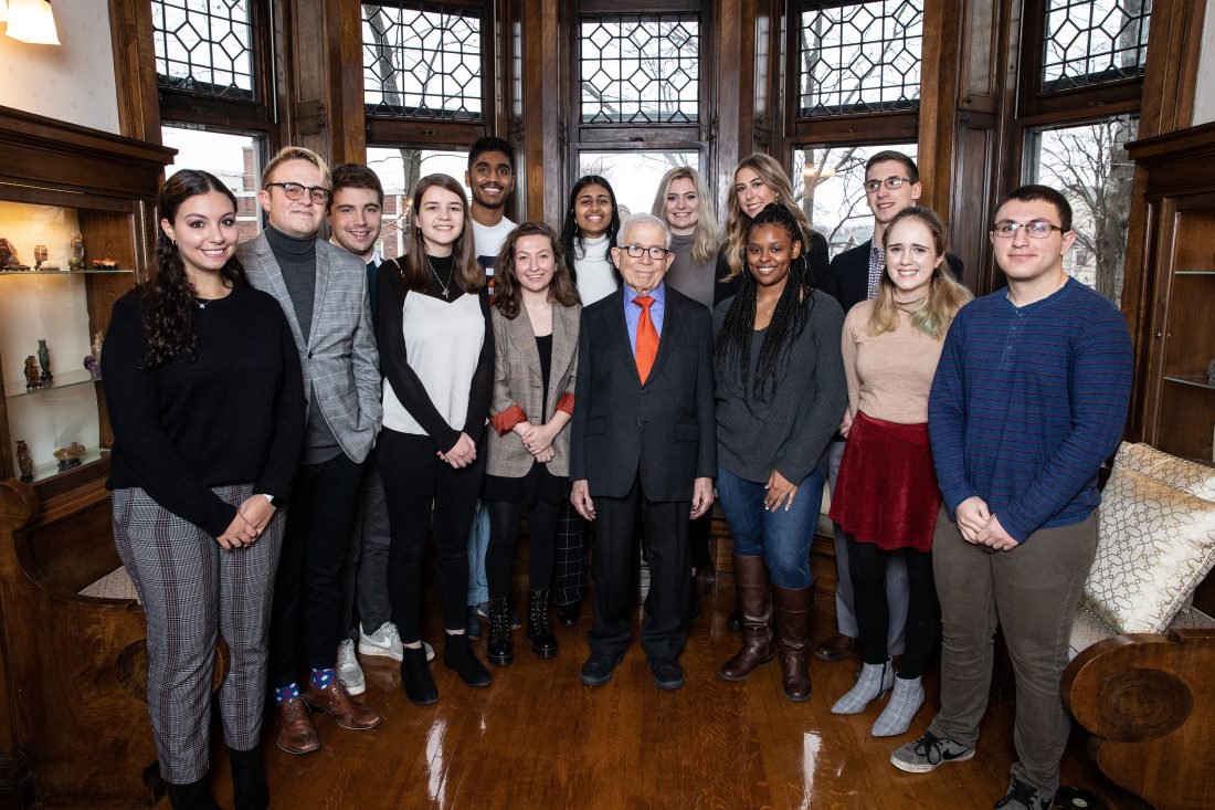 Donald Newhouse (center) with Newhouse students at the Chancellor’s house on the day of the $75 million gift announcement, Jan. 13, 2020.