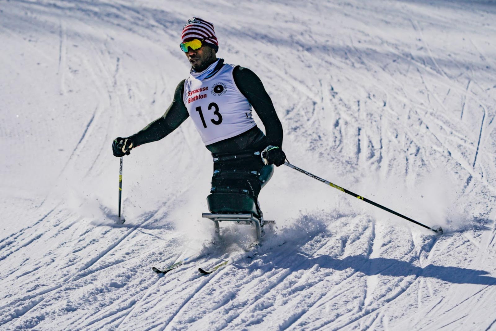 A skier racing down a slope.