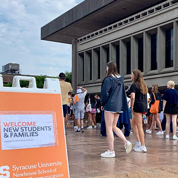 Dozens of new students gather on the Newhouse plaza for a welcome event Aug. 26.