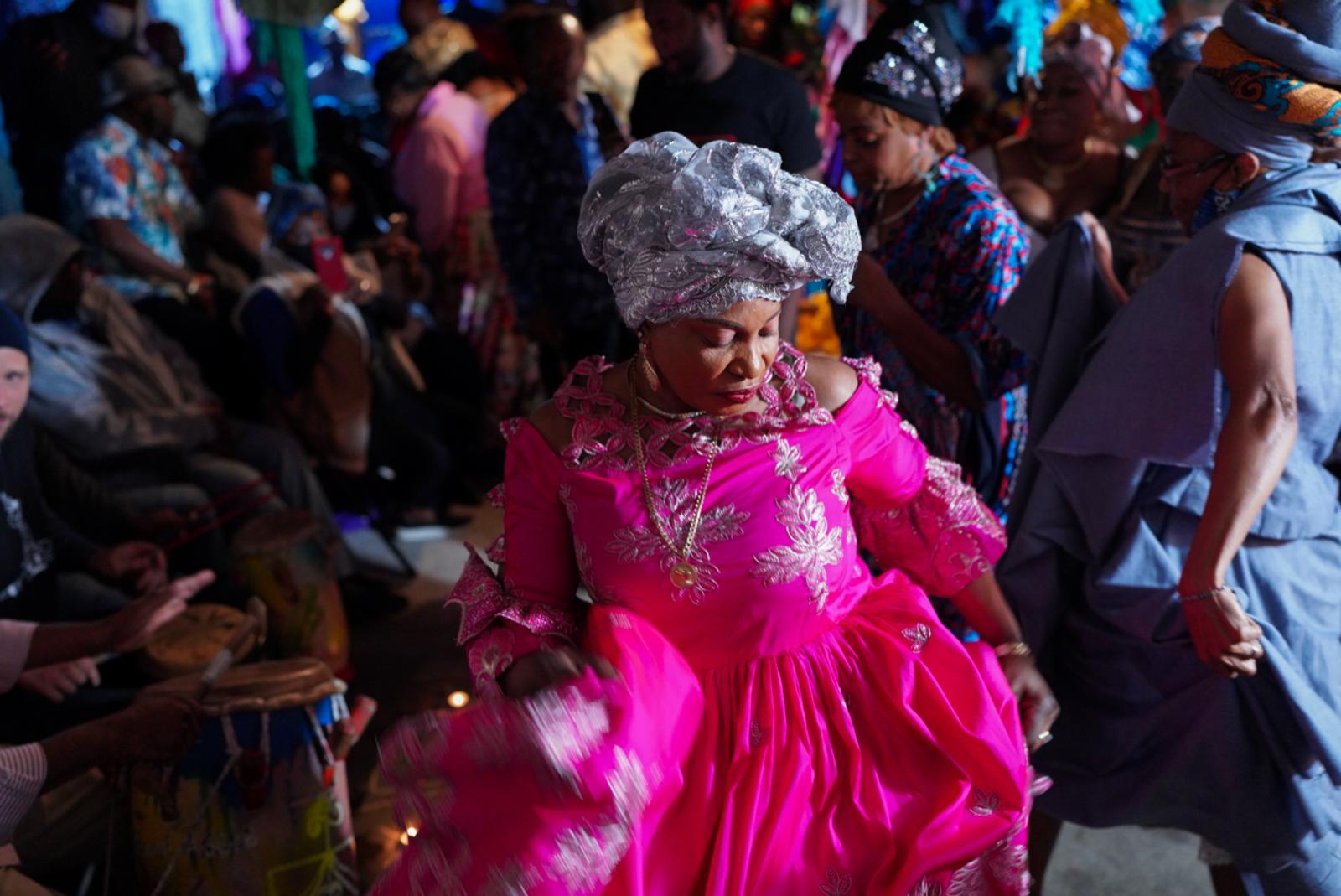 Vodou believers perform a ritual during a ceremony to honor their ancestors in a basement that serves as a temple in Brooklyn, New York. New York has the second-largest Haitian population in the United States after Miami.